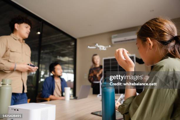 young business team meeting about sustainable energy. - drone pilot stock pictures, royalty-free photos & images