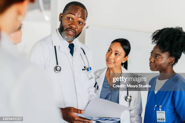 medicine, teamwork and research with a doctor, nurse and team looking at a x ray and working in a hospital. innovation, collaboration and healthcare with medical people at work in a health clinic - speech pathology stock pictures, royalty-free photos & images