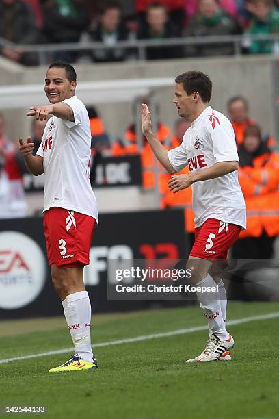 Ammer Jemal of Koeln celebrates the first goal with Sascha Riether during the Bundesliga match between 1. FC Koeln and SV Werder Bremen at...