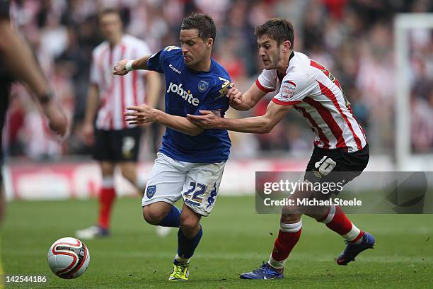 Adam Lallana of Southampton tracks Chris Maguire of Portsmouth during the npower Championship match between Southampton and Portsmouth at St Mary's...