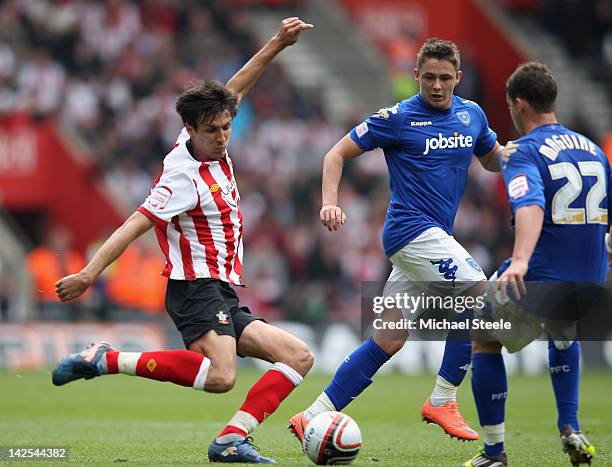 Jack Cork of Southampton watched by Scott Allan and Chris Maguire of Portsmouth during the npower Championship match between Southampton and...