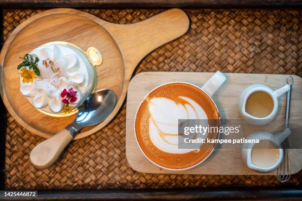 top view of hot tea and coconut cupcake - english tea room stockfoto's en -beelden