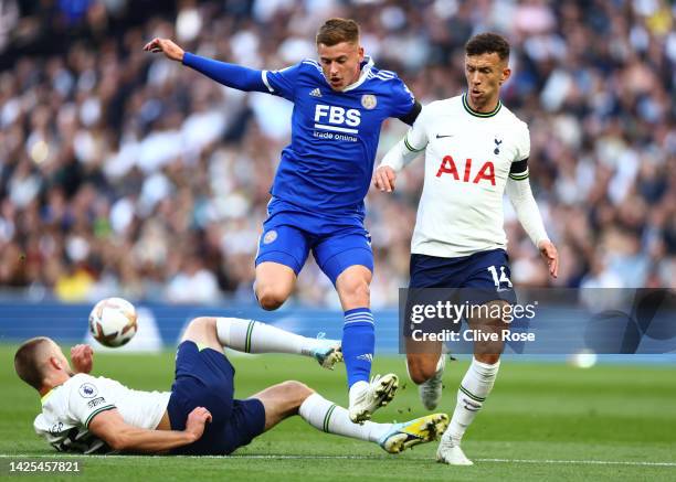 Harvey Barnes of Leicester City is tackled by Eric Dier and Ivan Perisic of Tottenham Hotspur during the Premier League match between Tottenham...