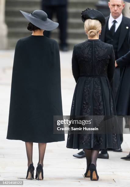 Meghan, Duchess of Sussex and Sophie, Countess of Wessex during the State Funeral of Queen Elizabeth II at Westminster Abbey on September 19, 2022 in...