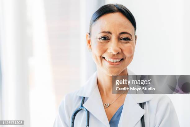 senior doctor, medical and healthcare woman worker in a hospital or health and wellness clinic. portrait of a cardiology expert, professional and consultant ready to work and help on consulting - doctor lab coat bildbanksfoton och bilder