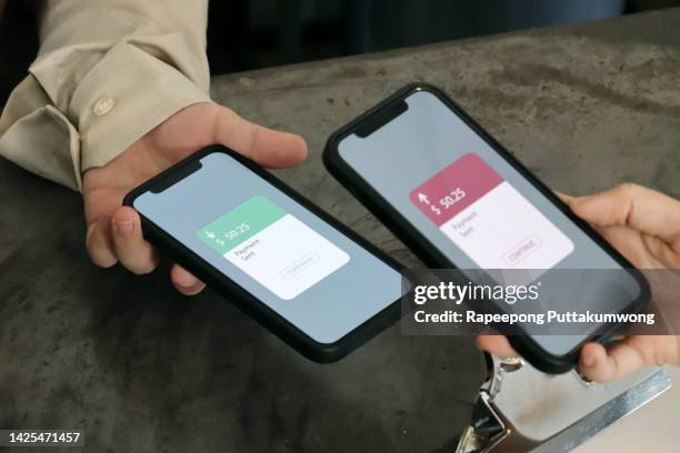 customer using phone for payment at cafe restaurant, cashless technology and money transfer concept - money transfer fotografías e imágenes de stock