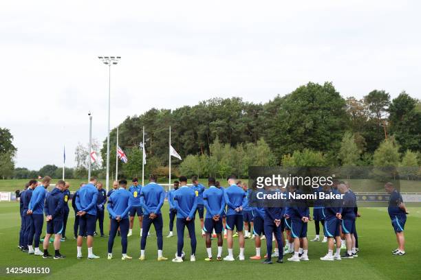 Players and staff take part in a minute’s silence as a tribute to Her Majesty Queen Elizabeth II who died at Balmoral Castle on September 8 during a...