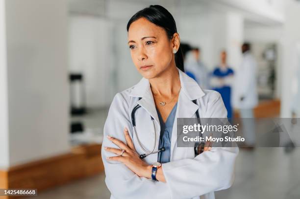 sad, tired and depressed doctor with mental health problem from working at hospital, thinking of idea with depression and doubt about medical surgery. healthcare nurse with anxiety and arms crossed - sad nurse stock pictures, royalty-free photos & images