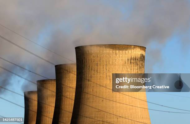 cooling towers and power lines - coal fired power station stock pictures, royalty-free photos & images