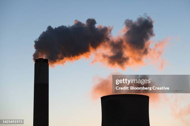 vapor rises from cooling towers - gas di scarico foto e immagini stock