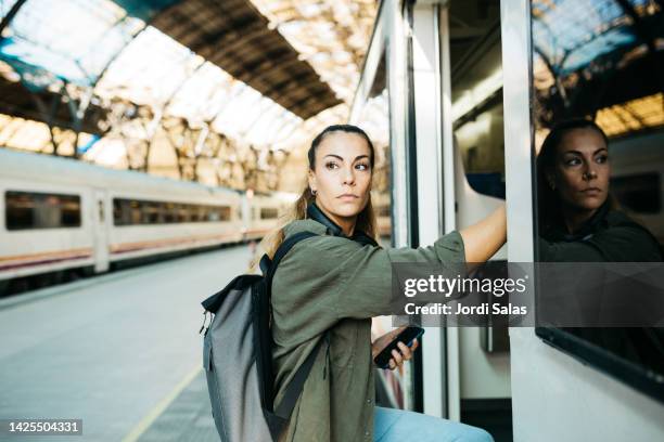 Getting A Train Boarding A Train With Luggage Photos and Premium High Res Pictures ...