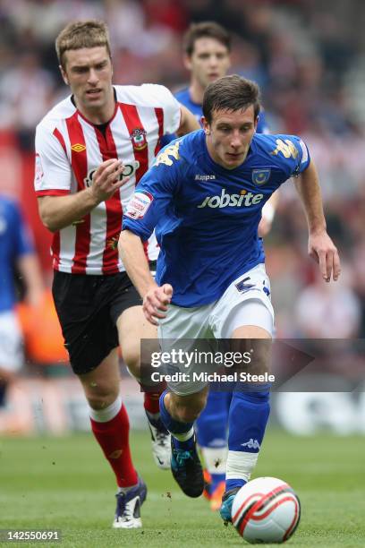 Jason Pearce of Portsmouth tracked by Rickie Lambert of Southampton during the npower Championship match between Southampton and Portsmouth at St...