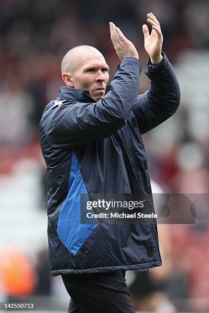 Michael Appleton manager of Portsmouth applauds the travelling supporters after his sides 2-2 draw during the npower Championship match between...