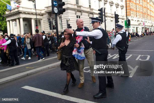 Police officer tries to contain the crowd afterwards at the end of the funeral of Queen Elizabeth II near Hyde Park on September 19, 2022 in London,...