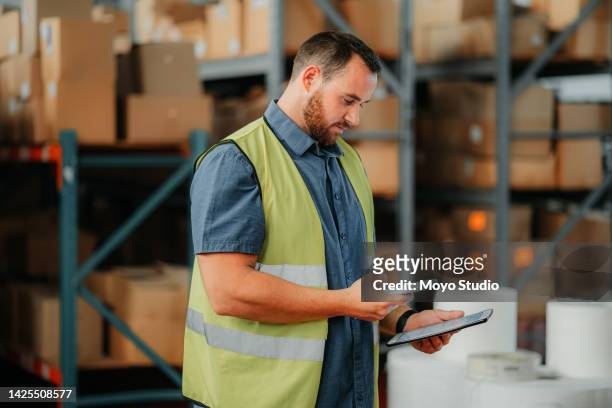 warehouse, stock and a man with a phone and tablet checking inventory online for delivery. tech, cargo and retail, a logistics worker with product list to package and box for global shipping service. - check box bildbanksfoton och bilder
