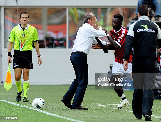 Sulley Muntari of AC Milan and ACF Fiorentina head coach Delio Rossi during the Serie A match between AC Milan and ACF Fiorentina at Stadio Giuseppe...