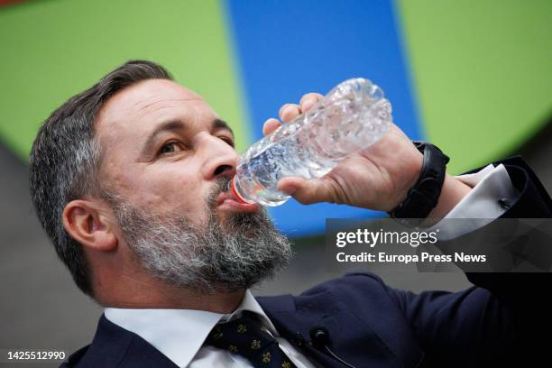 The president of VOX, Santiago Abascal, drinks water during the conference 'Leadership and political commitment to Spain', at the CEU San Pablo...