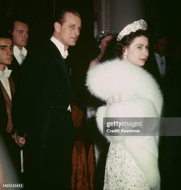 Queen Elizabeth II and her husband, Prince Philip at a gala event during a state visit to France, Paris, April 1957.