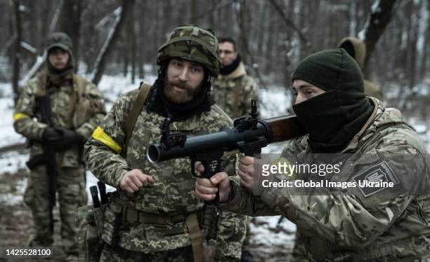 Ukrainian soldiers of Karpatska Sich Battalion practice with weapons in a forest on a defense line on March 1, 2022 in Kyiv, Ukraine. Russia launched...