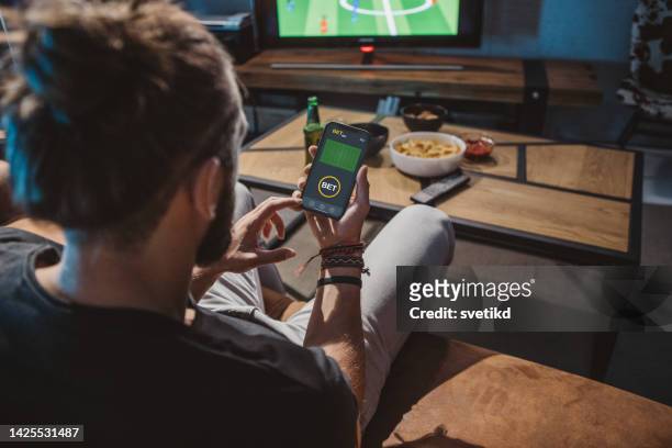 watching soccer game at home - gambling bildbanksfoton och bilder