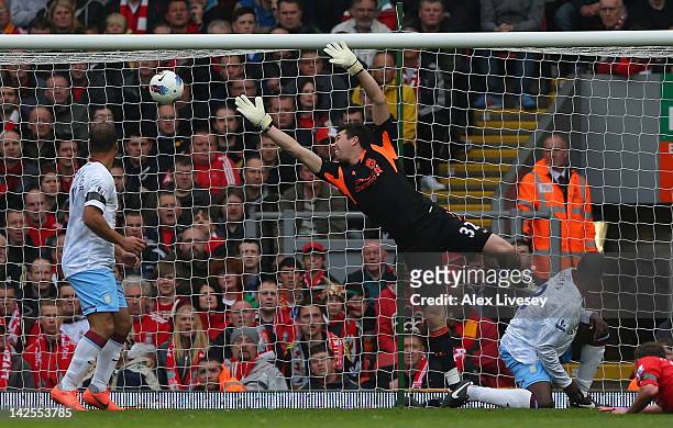 Doni of Liverpool is beaten by a shot from Chris Herd of Aston Villa for the opening goal during the Barclays Premier League match between Liverpool...