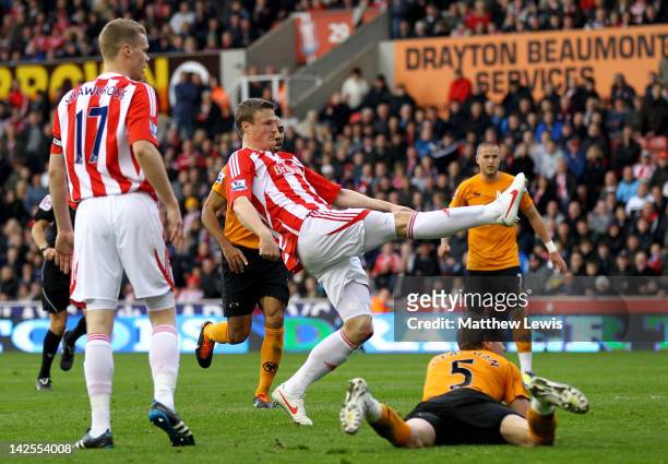 Robert Huth of Stoke City scores his team's first goal during the Barclays Premier League match between Stoke City and Wolverhampton Wanderers at the...