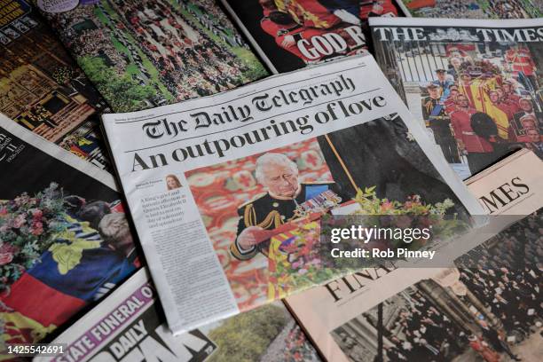 In this photo illustration coverage of the State Funeral of Queen Elizabeth II is seen on the front page of Britain’s The Daily Telegraph newspaper...
