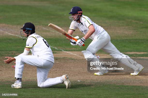 Dom Sibley of Warwickshire plays to long on as Ben Charlesworth of Gloucestershire looks on during day one of the LV=Insurance County Championship...