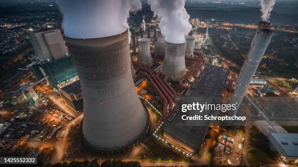 aerial view of a coal fired power station at night - coal fired power station 個照片及圖片檔