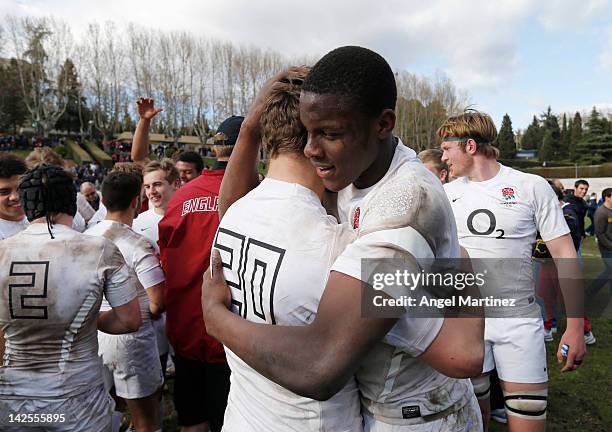 Maro Itoje of England celebrates with team mate Josh Buggea after winning the FIRA Cup final match between England U18 and Ireland U18 at Universidad...