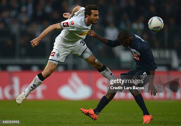 Martin Stranzl of Moenchengladbach is challenged by Ramos Vasquez of Berlin during the Bundesliga match between Borussia Moenchengladbach and Hertha...