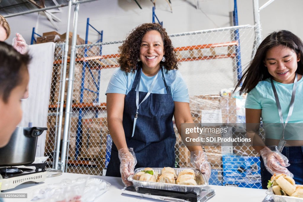 Female volunteer smiles for the camera
