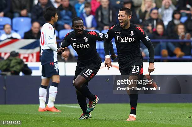 Clint Dempsey of Fulham celebrates after scoring his first goal from a free kick during the Barclays Premier League match between Bolton Wanderers...