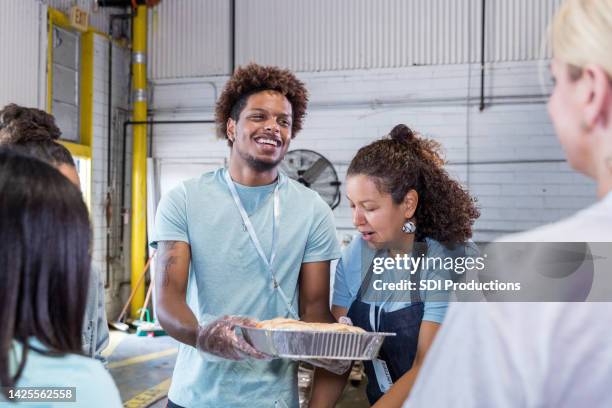 young adults volunteer - soup kitchen stock pictures, royalty-free photos & images
