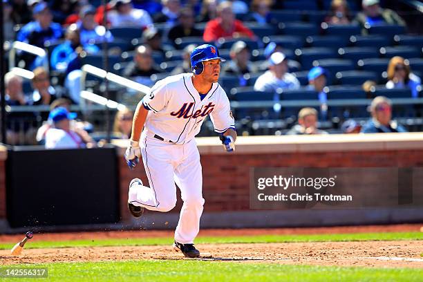 Josh Thole of the New York Mets hits an RBI in the 5th inning against the Atlanta Braves at Citi Field on April 7, 2012 in the Flushing neighborhood...