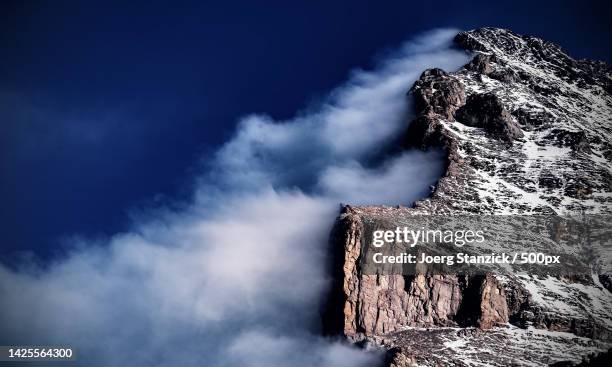 low angle view of rock formation against sky,wengen,lauterbrunnen,switzerland - lauterbrunnen stock pictures, royalty-free photos & images