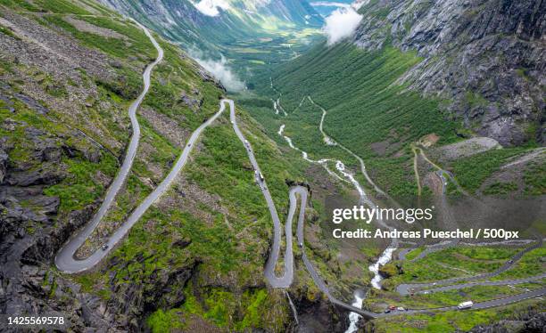 high angle view of winding road on mountain,trollstigen,norway - romsdal in norway stockfoto's en -beelden