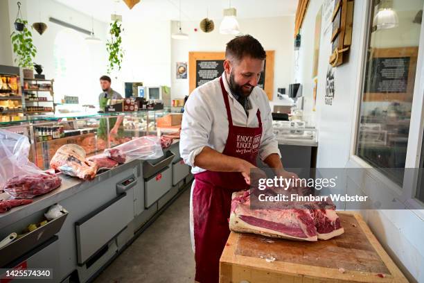 Butcher works in the Brace of Butchers, on September 20, 2022 in Poundbury, England. The inheritance of the Duchy of Cornwall has made the new Prince...