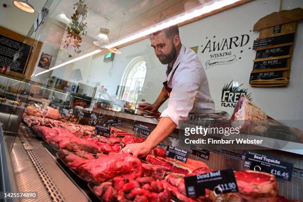 Butcher works in the Brace of Butchers, on September 20, 2022 in Poundbury, England. The inheritance of the Duchy of Cornwall has made the new Prince...