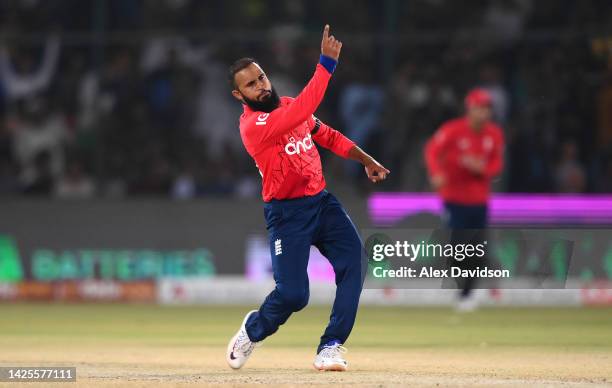 Adil Rashid of England celebrates taking the wicket of Babar Azam of Pakistan during the 1st IT20 match between Pakistan and England at Karachi...