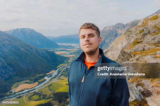 portrait of a male exploring the mountains of norway - summer norway people stock pictures, royalty-free photos & images