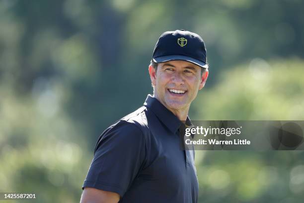 Adam Scott of Australia and the International Team smiles during a practice round prior to the 2022 Presidents Cup at Quail Hollow Country Club on...