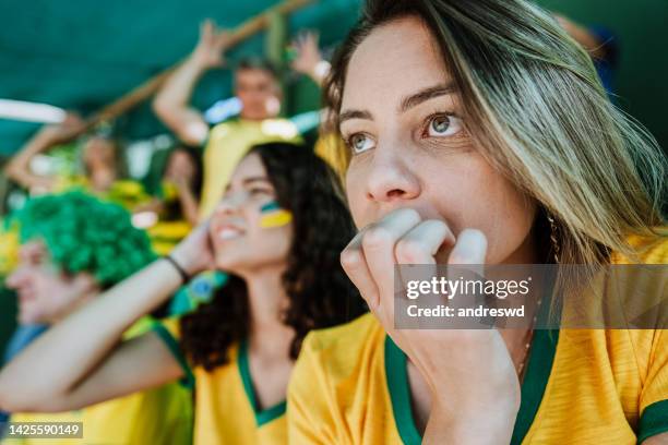 brazilian fans worried and sad at the stadium - defeat fear stock pictures, royalty-free photos & images