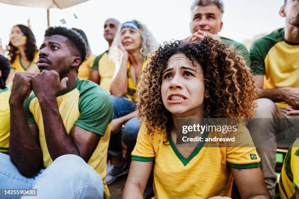 brazilian fans - moment of concern defeat - female fans brazil stock pictures, royalty-free photos & images