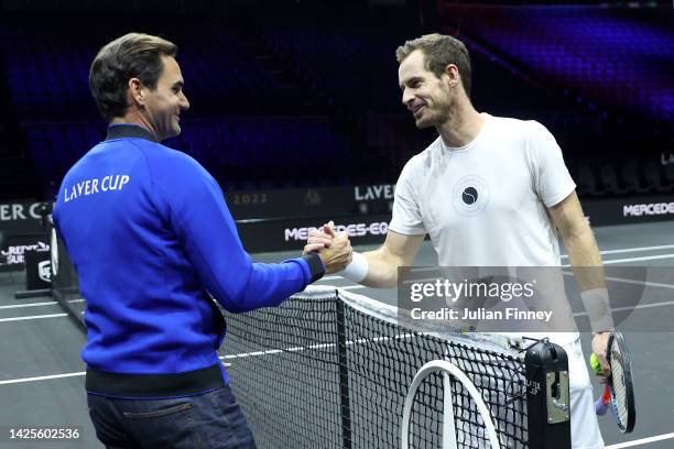 Roger Federer and Andy Murray of Team Europe shake hands during a practice session ahead of the Laver Cup at The O2 Arena on September 20, 2022 in...