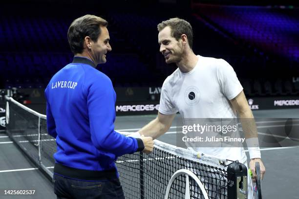 Roger Federer and Andy Murray of Team Europe shake hands during a practice session ahead of the Laver Cup at The O2 Arena on September 20, 2022 in...