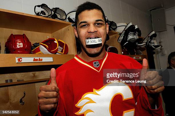 Akim Aliu of the Calgary Flames celebrates his first NHL goal after the game against the Anaheim Ducks on April 7, 2012 at the Scotiabank Saddledome...