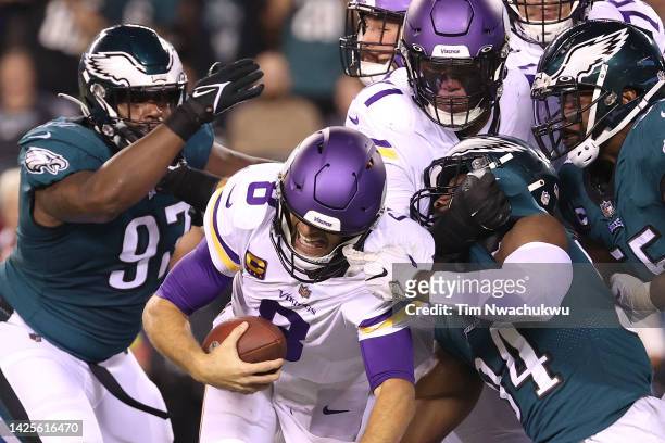 Kirk Cousins of the Minnesota Vikings is tackled by Josh Sweat of the Philadelphia Eagles at Lincoln Financial Field on September 19, 2022 in...