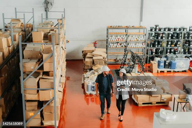 logistics, warehouse and shipping factory store employee with tablet in hand, shipping or cargo factory. management, boss or ceo of business working in supply chain industry and delivery company - organisation environnement stockfoto's en -beelden