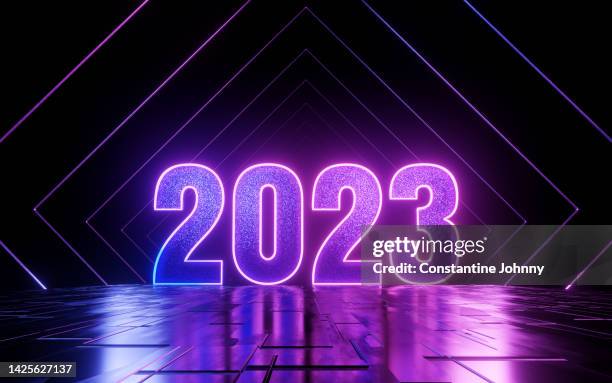 futuristic neon light 2023 text on abstract reflective floor - glowing letters stock pictures, royalty-free photos & images